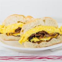 2 Eggs With Bacon Or Ham · Comes standard with 2 eggs on your choice of  a Roll, Bagel or Bread. (You can add on extra ...