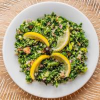 Tabule · Bulgur wheat	salad with	peppers, scallions, and parsley, tossed with lemon juice and olive	o...