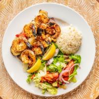Shrimp Kebab · served with rice and Rumi salad. Charbroiled seasonal jumbo shrimp with veggie.