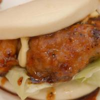 Chicken Bao · 2 Pieces BAO  pan fried chicken with teriyaki lettuce and mayo.