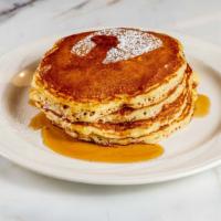 Pancakes, Waffles Or French Toast · Dusted with Powdered Sugar