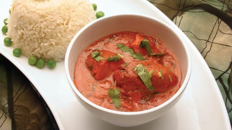 Chicken Tikka Masala · Boneless pieces of chicken tikka cooked in a creamy butter sauce with fresh tomatoes and fragrant spices.