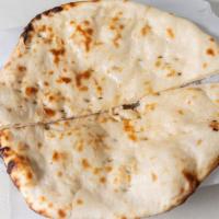 Naan · Traditional Punjabi style tear-drop shaped white bread baked on the sides of our tandoori ov...