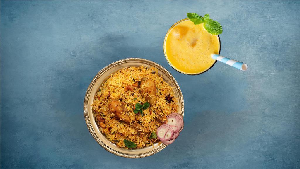 Peshawari Chicken Biryani & Fresh Yogurt Mango Smoothie · Our long grain basmati rice cooked with chicken marinated in yogurt and house spices fresh vegetables and chicken in our special biryani masala gravy, served with a side of yogurt raita comes with Chilled churned yogurt drink with alphonso mango.