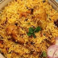 Peshawari Chicken Biryani · Our long grain basmati rice cooked with chicken marinated in yogurt and house spices fresh v...