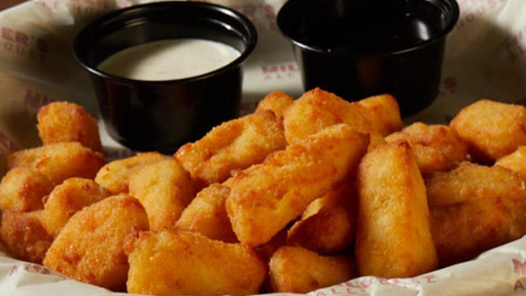 Cheese Curds · Crispy fried bite-sized Wisconsin Cheddar Cheese Curds, spiced honey, ranch dressing