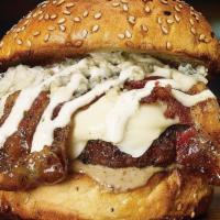 Black & Blue Burger* · Peppered bacon, blue cheese crumbles, melted white American cheese, blue cheese sauce and ga...