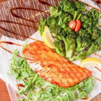 Salmon Steak · Served with grilled broccoli, arugula, teriyaki sauce & side of your choice