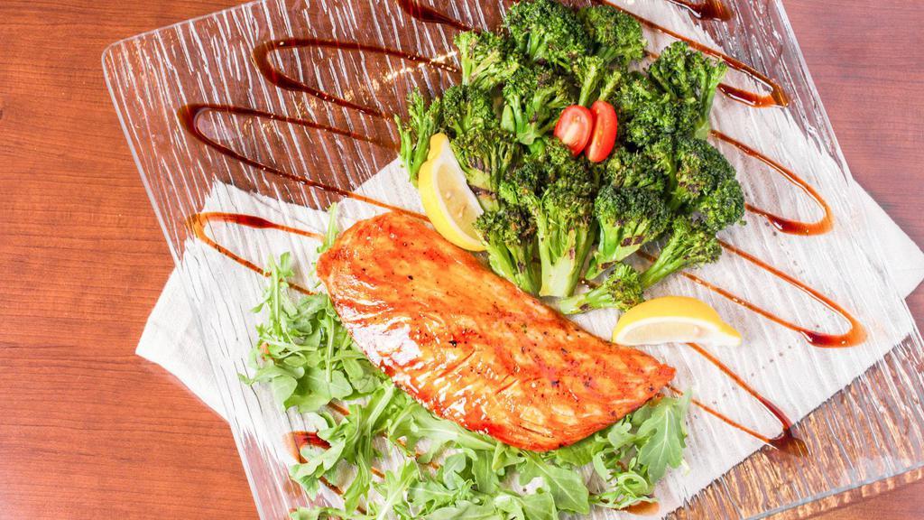 Salmon Steak · Served with grilled broccoli, arugula, teriyaki sauce & side of your choice