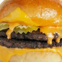 Double Cheeseburger · 2 100% Black Angus Beef Patties, American & Aged Cheddar, Dill Pickles & Burger Sauce On A P...