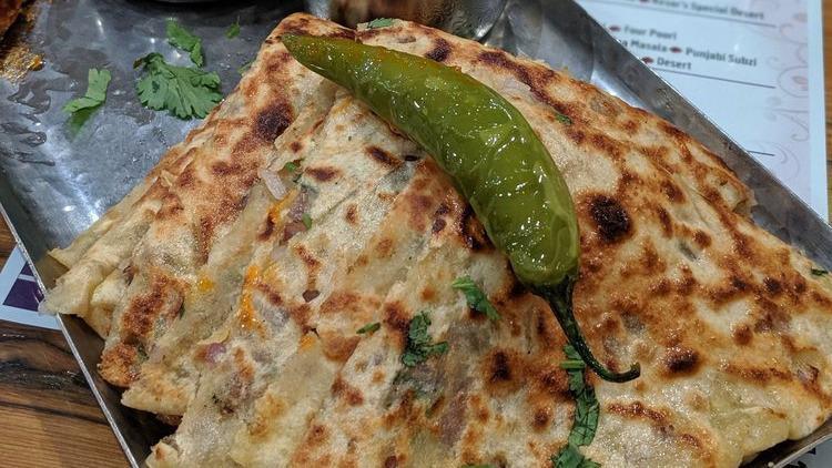 Aloo Piyaz Paratha · Thick Indian wheat flatbread with stuffing of potato and onion.
