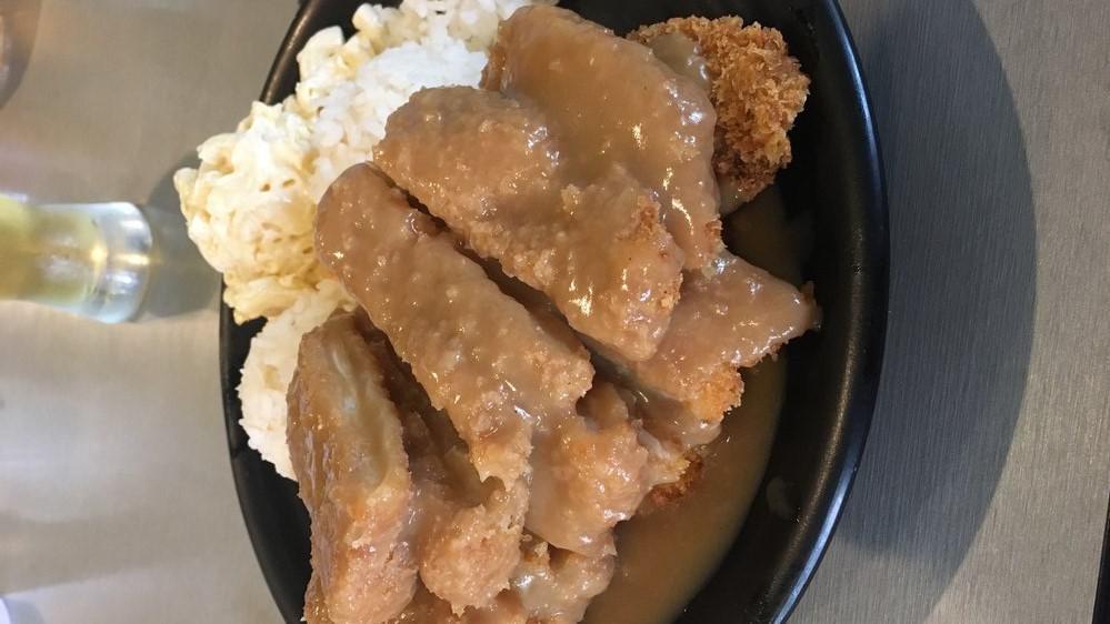 Chicken Cutlet With Gravy · Regular plate lunch includes 2 scoops of rice and 1 scoop of macaroni salad. Mini plate lunch includes 1 scoop of rice and 1 scoop of macaroni salad.