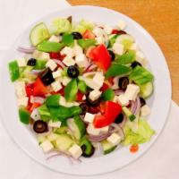 Greek Salad · iceberg Lettuce, tomatoes, cucumbers, red  onions, olives, green peppers, and Feta cheese.