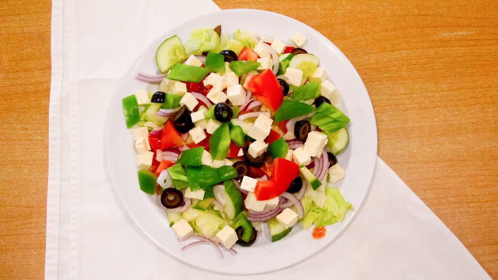 Greek Salad · iceberg Lettuce, tomatoes, cucumbers, red  onions, olives, green peppers, and Feta cheese.