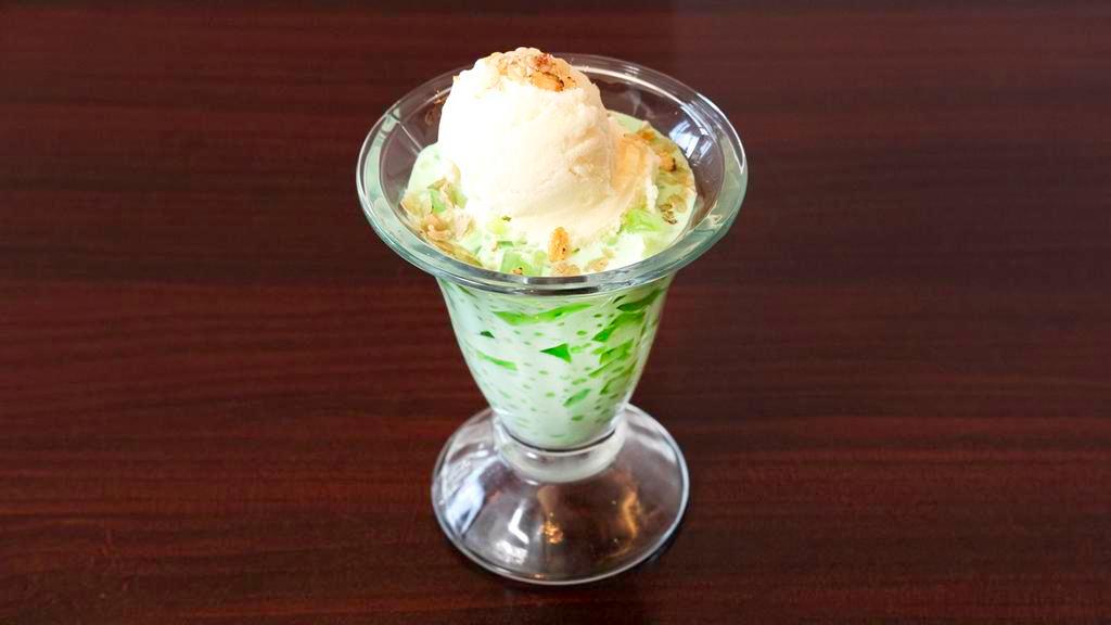 Buko Pandan · Young coconut mixed with pandan leaf (screwpine) gelatin and tapioca in a rich fluffy cream sauce, with macapuno (coconut) ice cream and rice flakes.