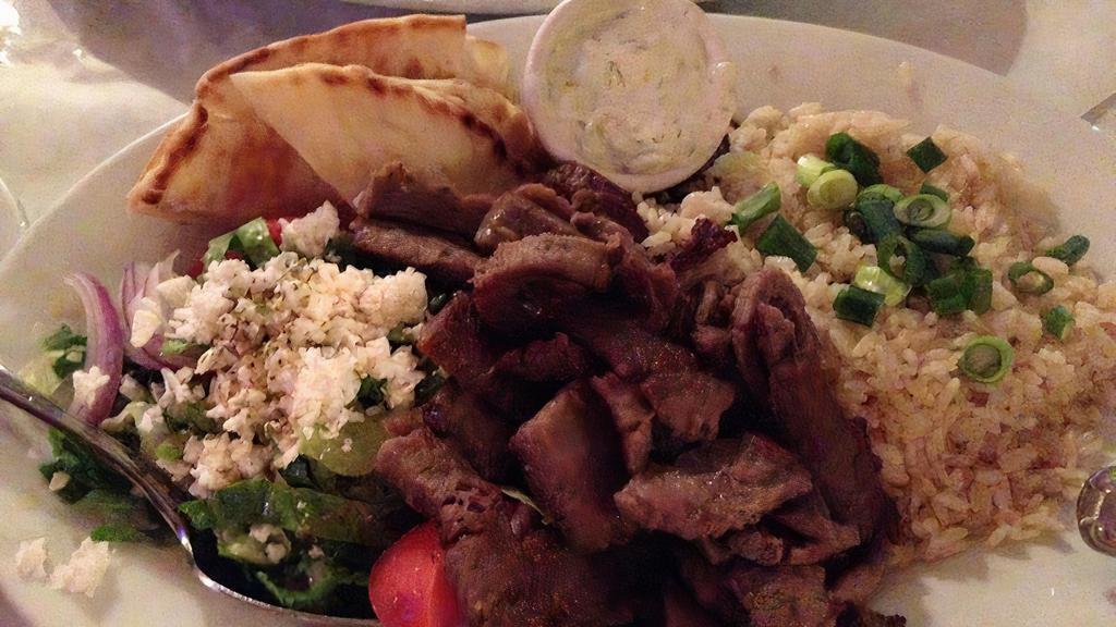 Lamb Gyro Platter · Strips of mouthwatering lamb served with Greek fries, salad, tzatziki, and pita bread.