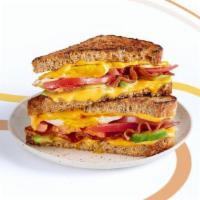New Wave Fave · American cheese, bacon, fresh tomato, over-medium eggs*, and avocado on multigrain bread