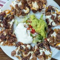 Bandido Nachos Lunch · Plain or with protein. Tortilla chips with refried beans, melted cheese, lettuce, pico de ga...