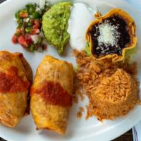Chimichangas Lunch · Two fried flour tortillas, stuffed with chicken and melted cheese, topped in a red tomatillo...