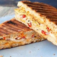 Pimento Chicken Panini · Lemon Herb Chicken, Goat Cheese, Roasted Red Onion & Red Peppers, Focaccia