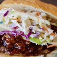 Pulled Pork & Apple Slaw · Pulled pork topped with a tangy fresh cabbage and apple slaw on a Kaiser roll