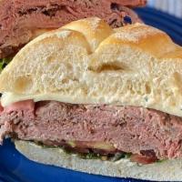 The Parker House · Grass-fed roast beef, provolone cheese, romaine lettuce, tomato and horseradish sauce on a K...