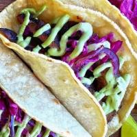 Steak Tacos · Grilled Steak, avocado crema, red cabbage-pickled jalapeño slaw, radish, lime, corn tortilla...