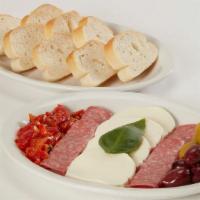 Antipasto · Fresh mozzarella, oven-roasted sweet red peppers, green salami, olives and fresh-baked bread.