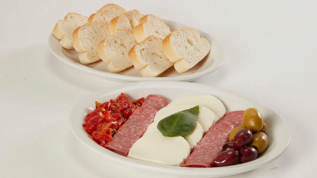Antipasto · Fresh Mozzarella, oven roasted sweet red peppers, Genoa salami, olives and fresh baked bread.