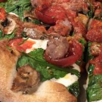 The Garden · Our traditional pizza topped with fresh Roma tomatoes, sliced onions, mushroom and black oli...