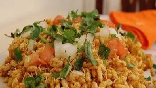 Bombay Bhelpuri · One of the most popular street foods in india. Delicious mixture of puffed rice, sev, tomato, potato, onion and sweet-sour-spicy chutneys.