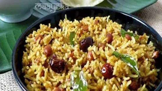 Tamarind Rice · Rice cooked in tamarind and spices served with sambar and papad.