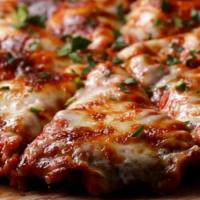 Chicken Parmigiana Pizza · Marinara sauce, chicken , , parmesan, ricotta and mozzarella cheese.