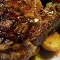 Brizola · Grilled rib-eye steak, lemon potatoes, grilled vegetables and mavrodaphne demi glace.