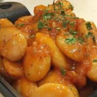 Gigantes · Gluten-free. Giant lima beans, baked with tomatoes and fresh herbs.