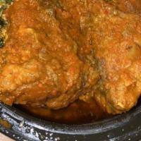 Egusi · Egusi (Collard Green w/ melon seed) soup, packed in a 54 oz bowl topped with assorted Meat o...
