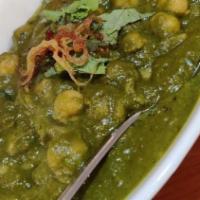 Channa (Chickpeas) Saag · Protein cooked in a creamy spinach sauce.
