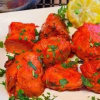 Nawabi Tikka · Chicken breast marinated in mild spices, yogurt, and aromatic herbs and broiled in the tando...