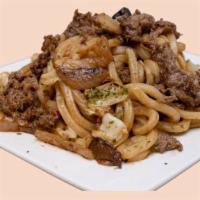 Pan Fried Udon · Stir-Fried Udon Noodles with onions, mushroom, cabbage.