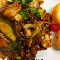 Triple Crown · Jumbo shrimp, chicken and tender scallop and beef sirloin sautéed with vegetables in brown s...