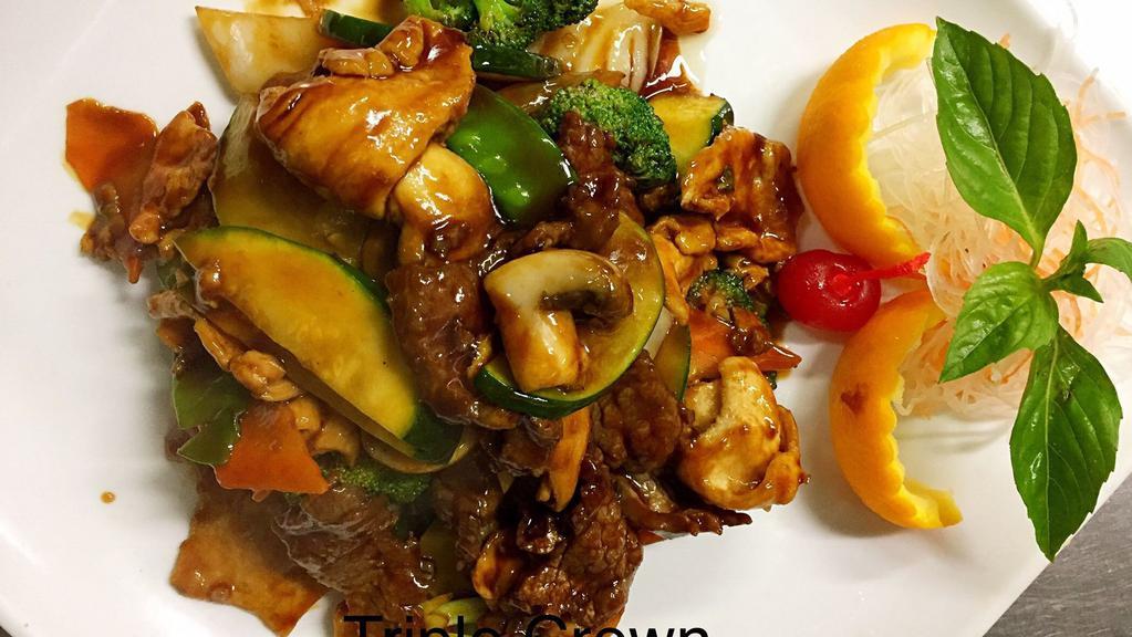 Triple Crown · Jumbo shrimp, chicken and tender scallop and beef sirloin sautéed with vegetables in brown sauce.