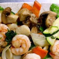 Treasures Of The Sea · Shrimp and scallops sautéed with fresh basil and vegetables in chef's special white sauce.
