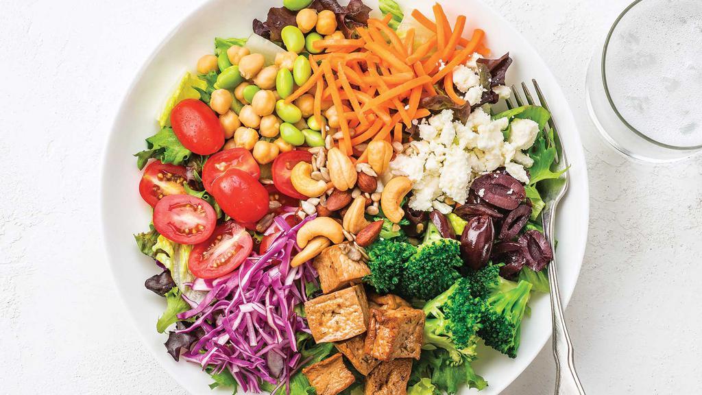 Regular Nature'S Market Salad · Organic field greens and romaine with herb-baked tofu, kalamata olives, grape tomatoes, matchstick carrots, edamame & garbanzo beans mix, red cabbage, broccoli, feta cheese, sunflower seeds, cashews, soya flavored almonds, and Curry Yogurt Dressing.