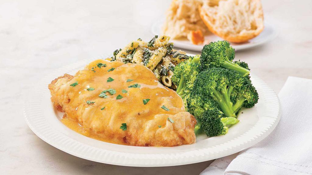 Chicken French Meal · Ready to heat, our tender egg-battered chicken is topped with lemon butter sauce and served with sautéed greens and potato gratin.