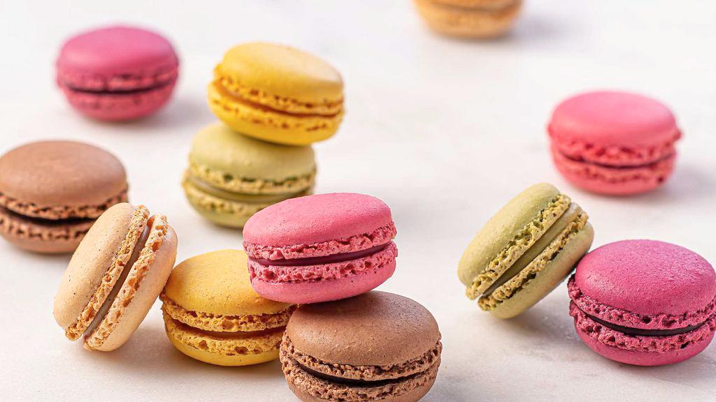 French Macaron Tray - 12 Count · Classic and delicately sweet, French-style cookies. Flavors include Lemon, Vanilla, Chocolate, Raspberry, Black Currant, and Pistachio. All flavors are made with almond flour.
