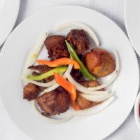 Griot (Fried Pork) · served with rice salad included