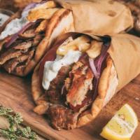 Original Greek Gyro! · Beef or chicken on a pita bread with lettuce, tomatoes, onions, tzatziki sauce and side of f...