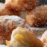 Croissant Beignet · Our Croissant Beignet is a flaky spin on the traditional beignet. As a feature in homestyle ...