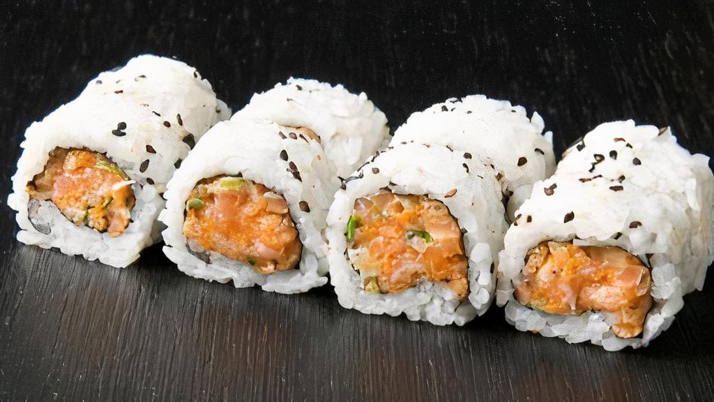 Spicy Salmon Roll · 8pc inside out roll with cucumber and avocado.