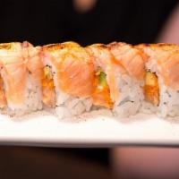 Dancing Monkey Roll · Spicy salmon, mango, yellow tail, avocado, blow torched mayo.